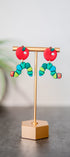 Colorful caterpillar earrings with red apple