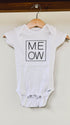 White baby onesie with 'MEOW' print