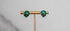 Small green alien face stud earrings with gold detailing