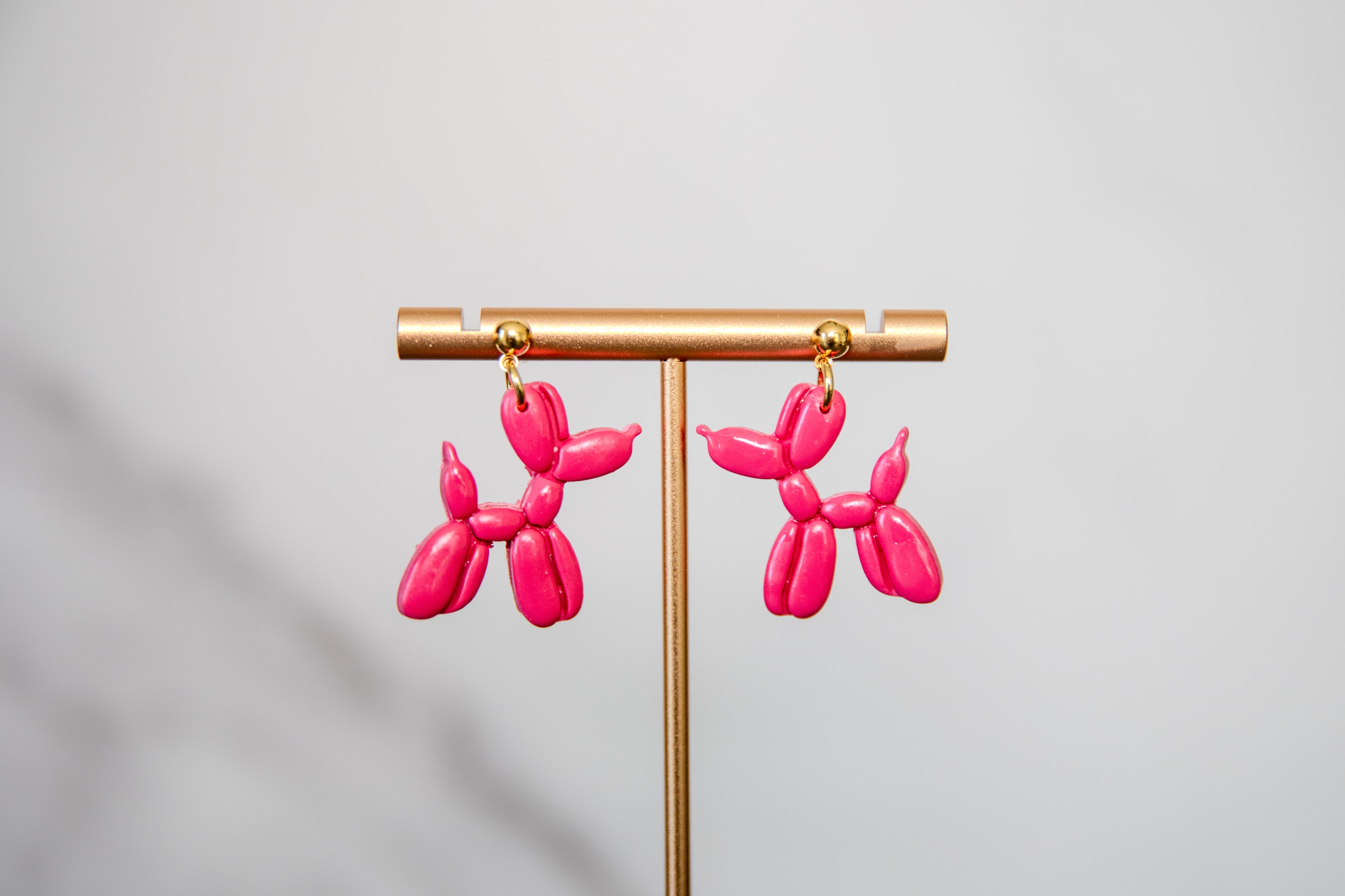 Pink balloon dog hanging earrings