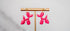 Pink balloon dog hanging earrings