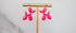 Pink balloon dog hanging earrings