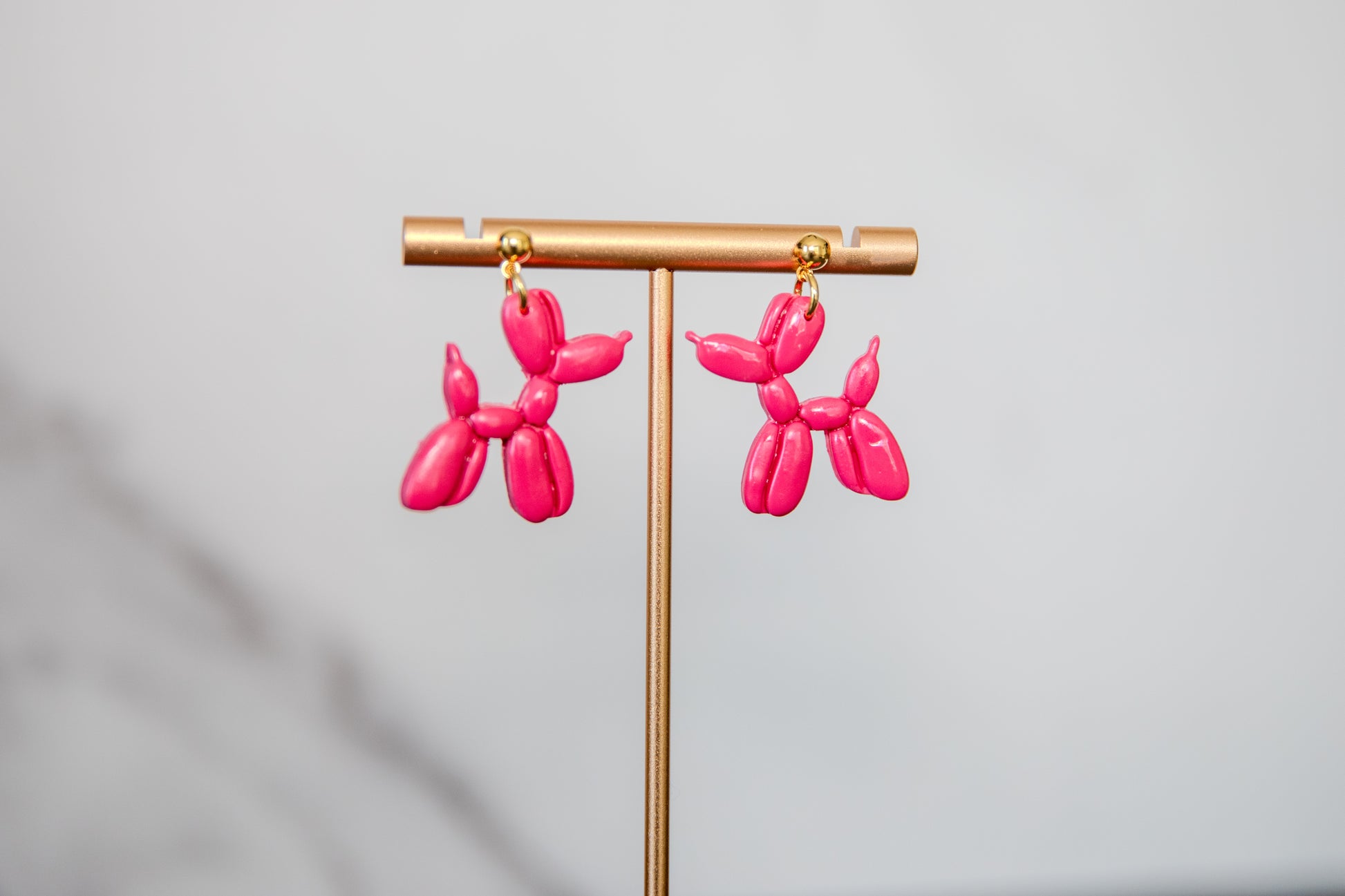 Pink balloon dog hanging earrings