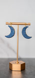 Blue glitter crescent moon earrings with gold edges