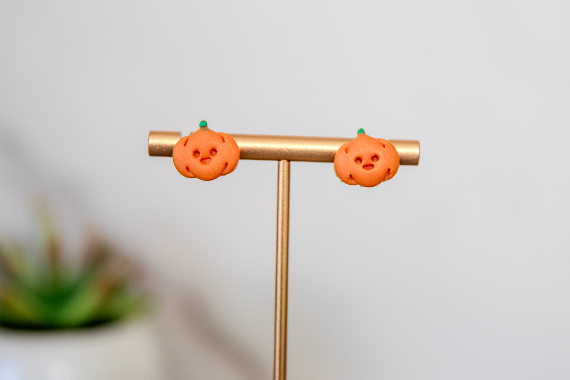 Pumpkins with happy face polymer clay autumn stud earrings