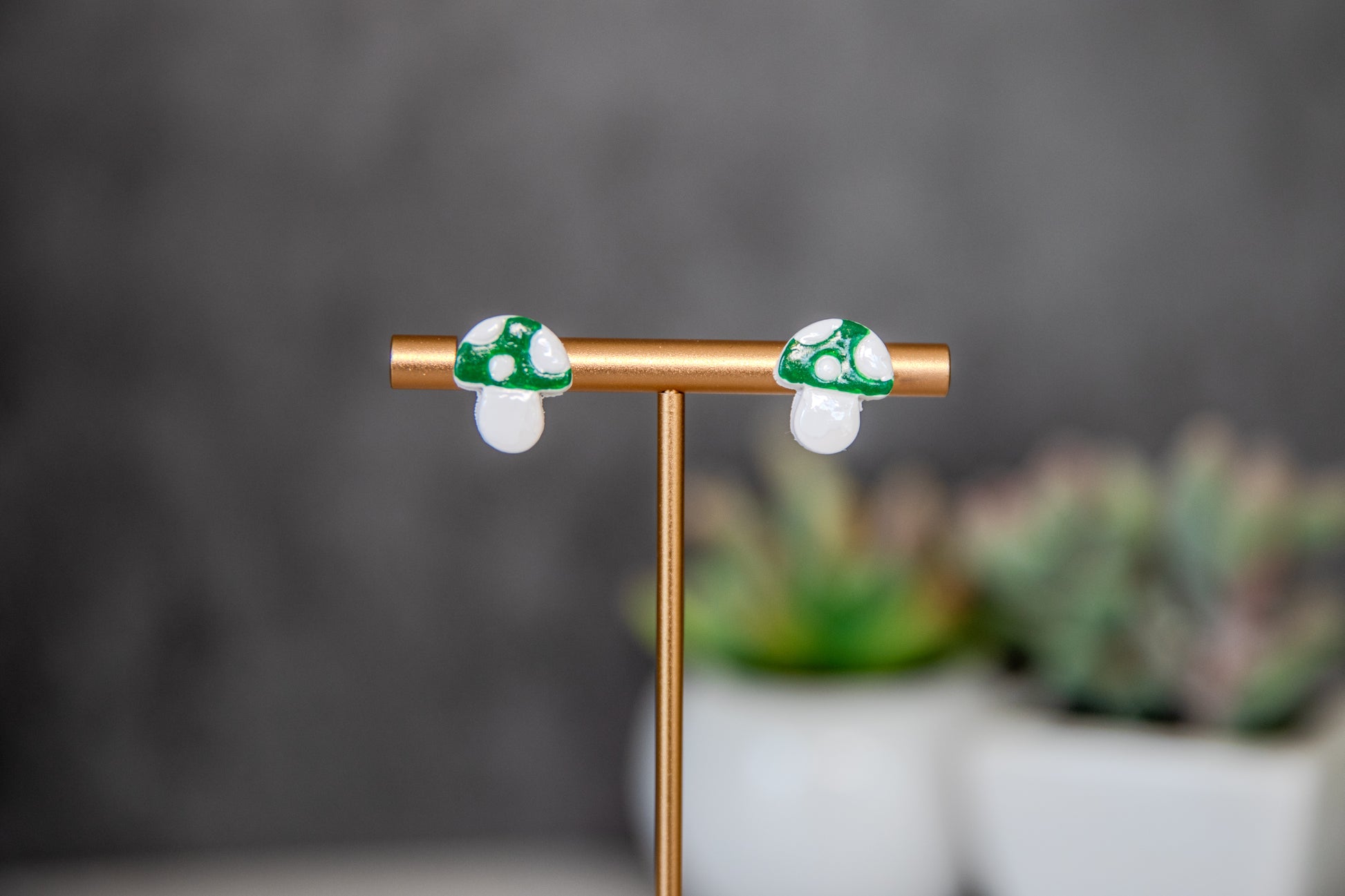 Green colored toadstool stud earrings