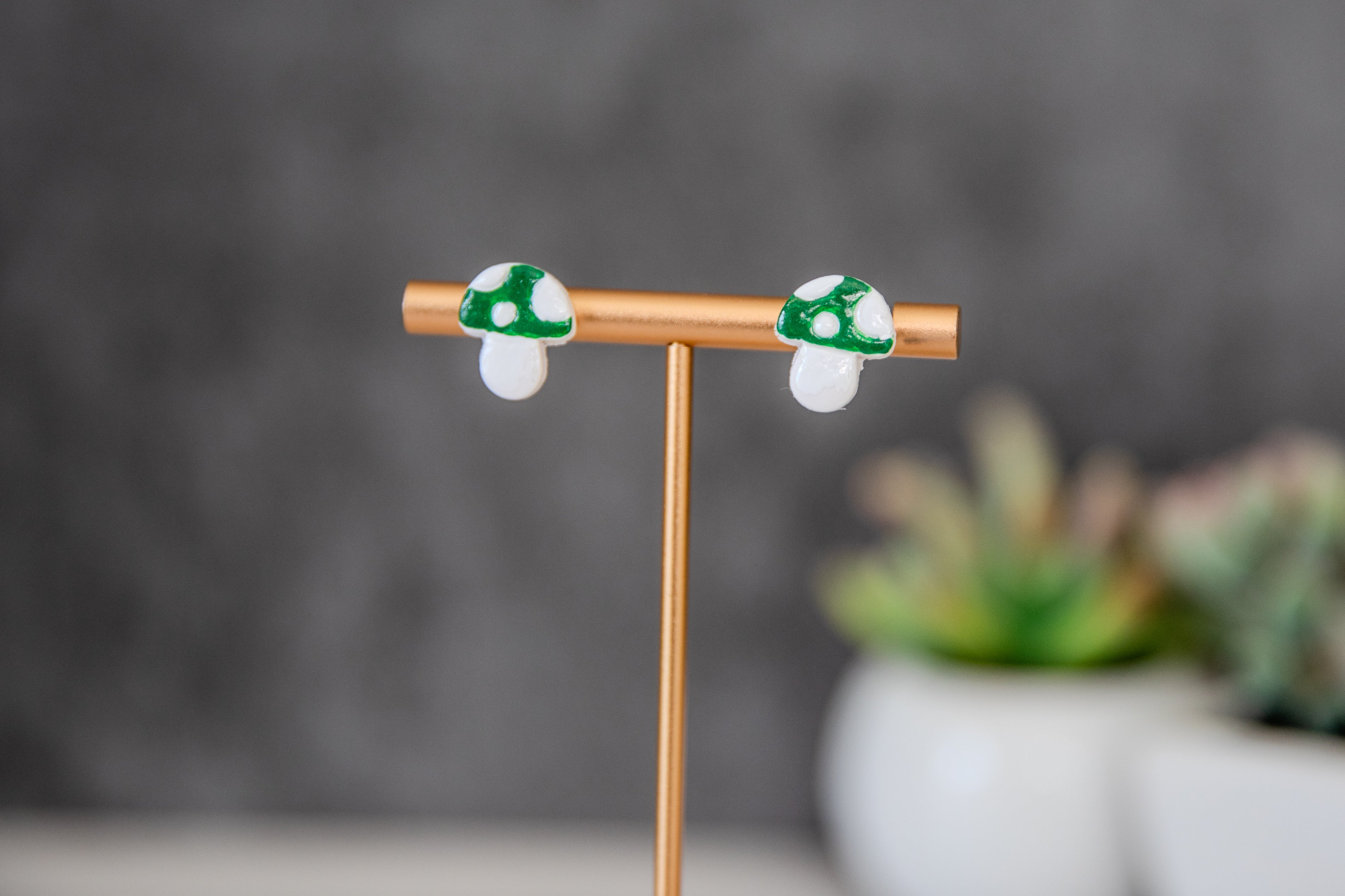 Green colored toadstool stud earrings