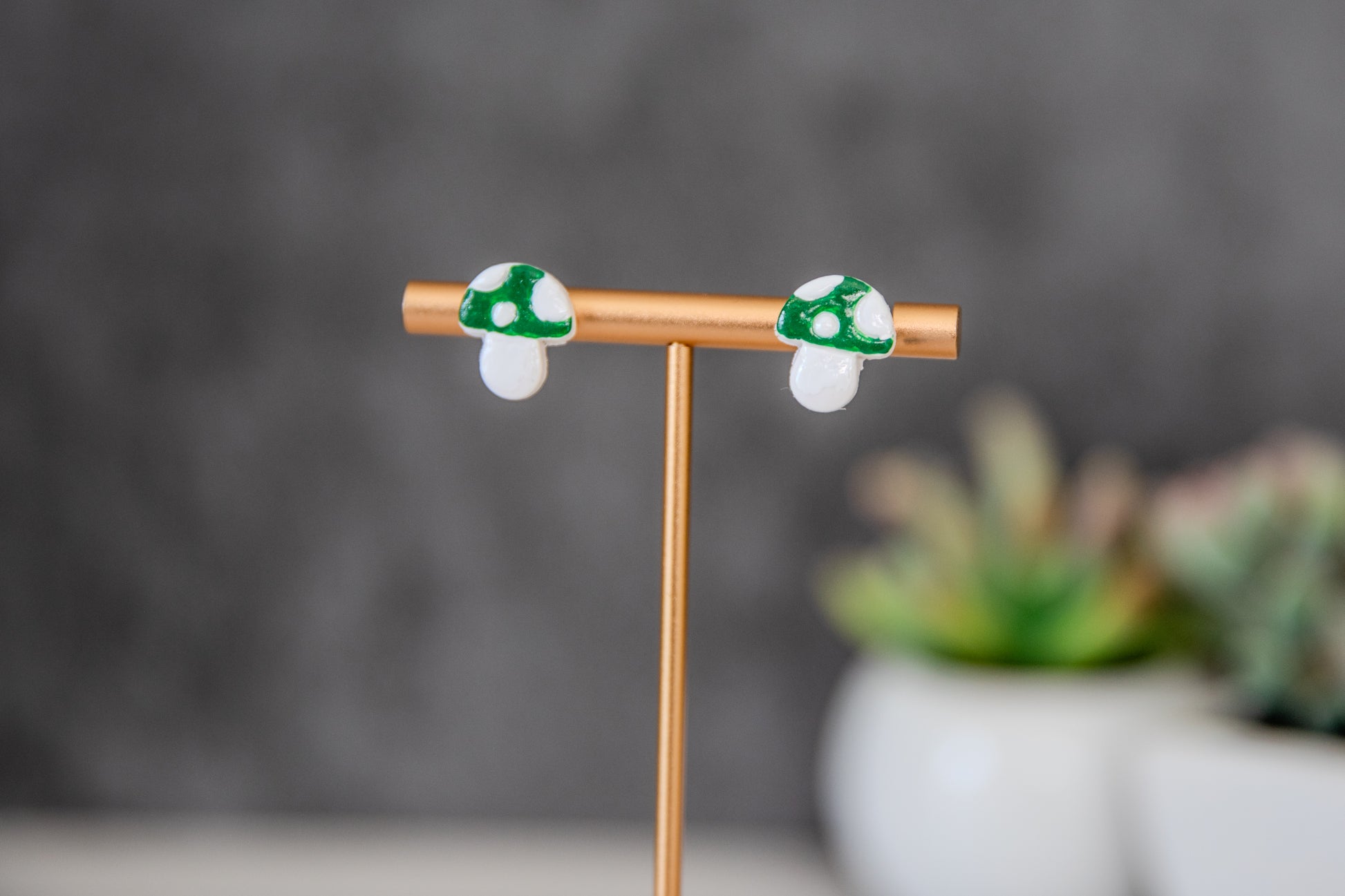 Green colored toadstool stud earrings