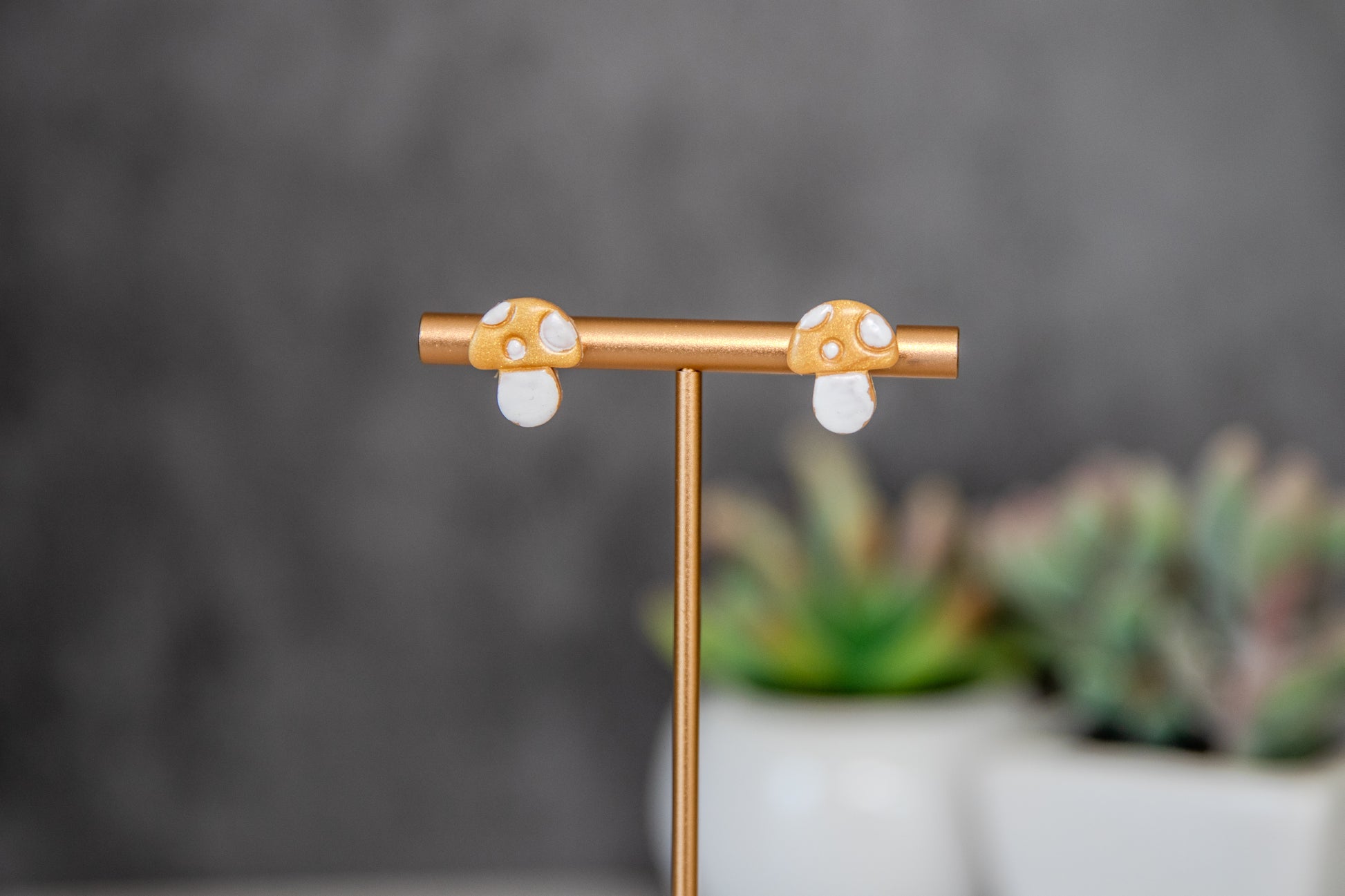 Gold colored toadstool stud earrings
