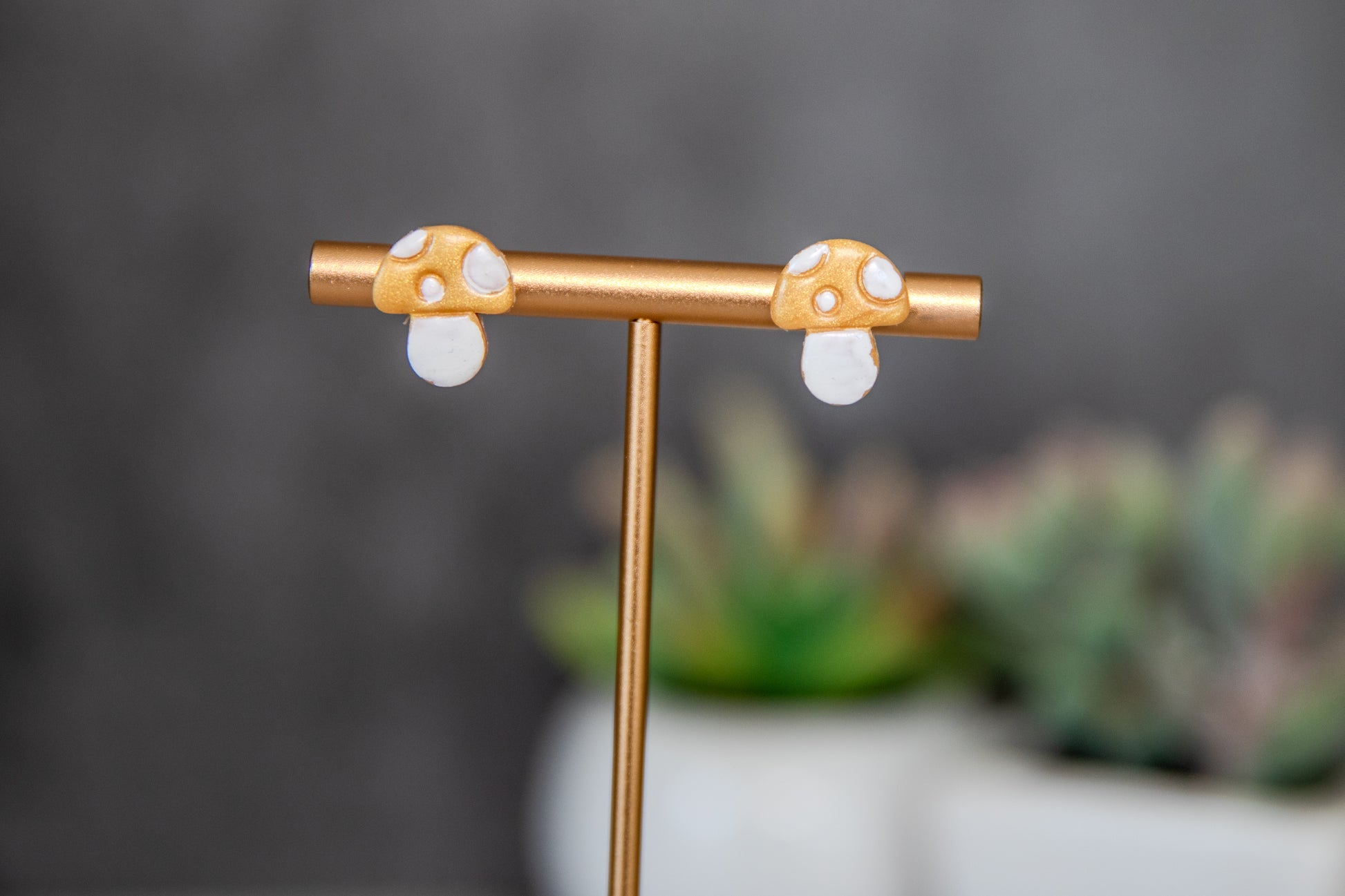 Gold colored toadstool stud earrings