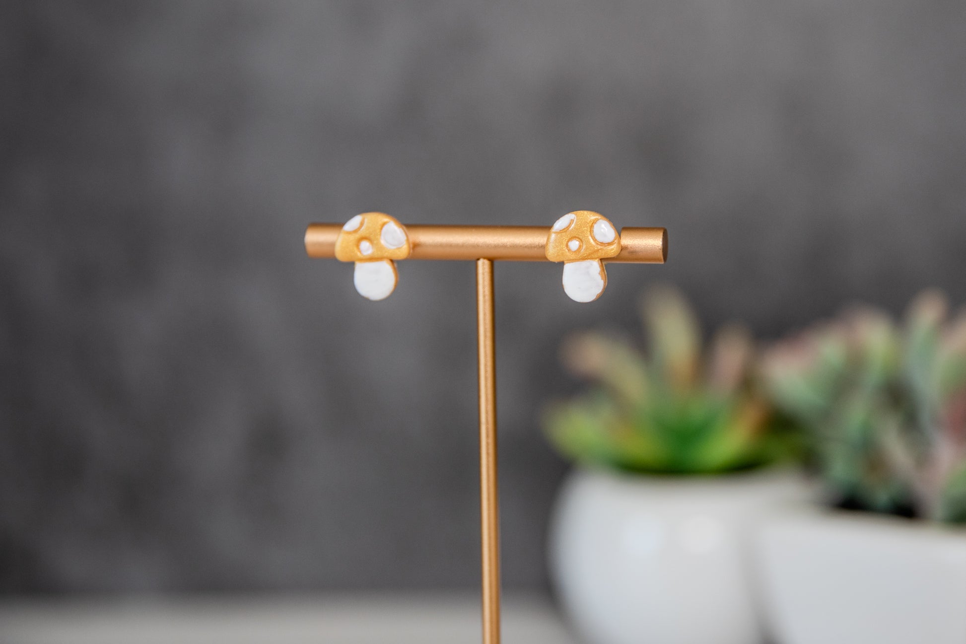 Gold colored toadstool stud earrings