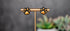 Black paw print stud earrings with gold pads