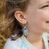 Girl wearing mummy cat earrings