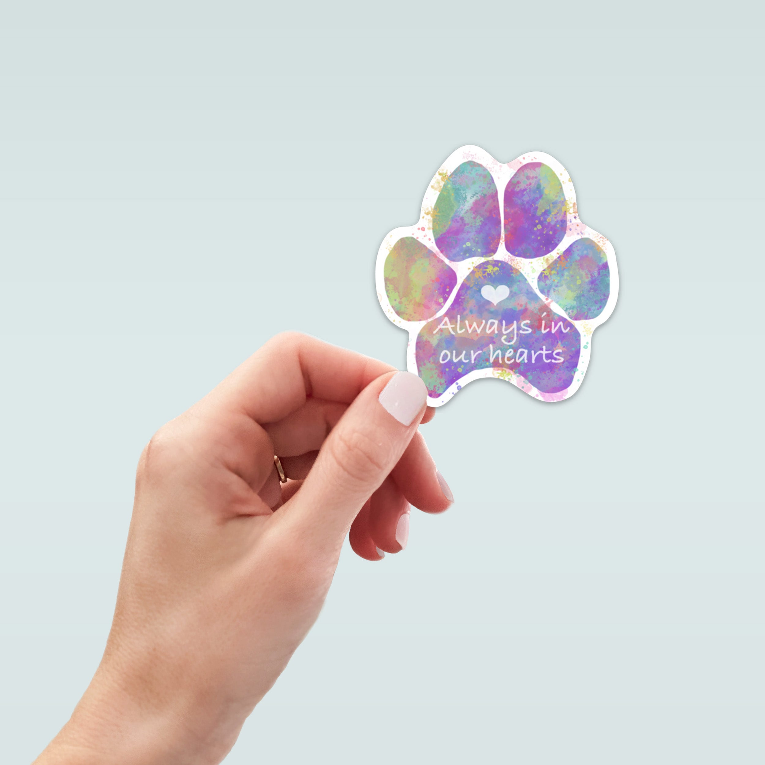 Colorful paw print sticker with 'Always in our hearts'