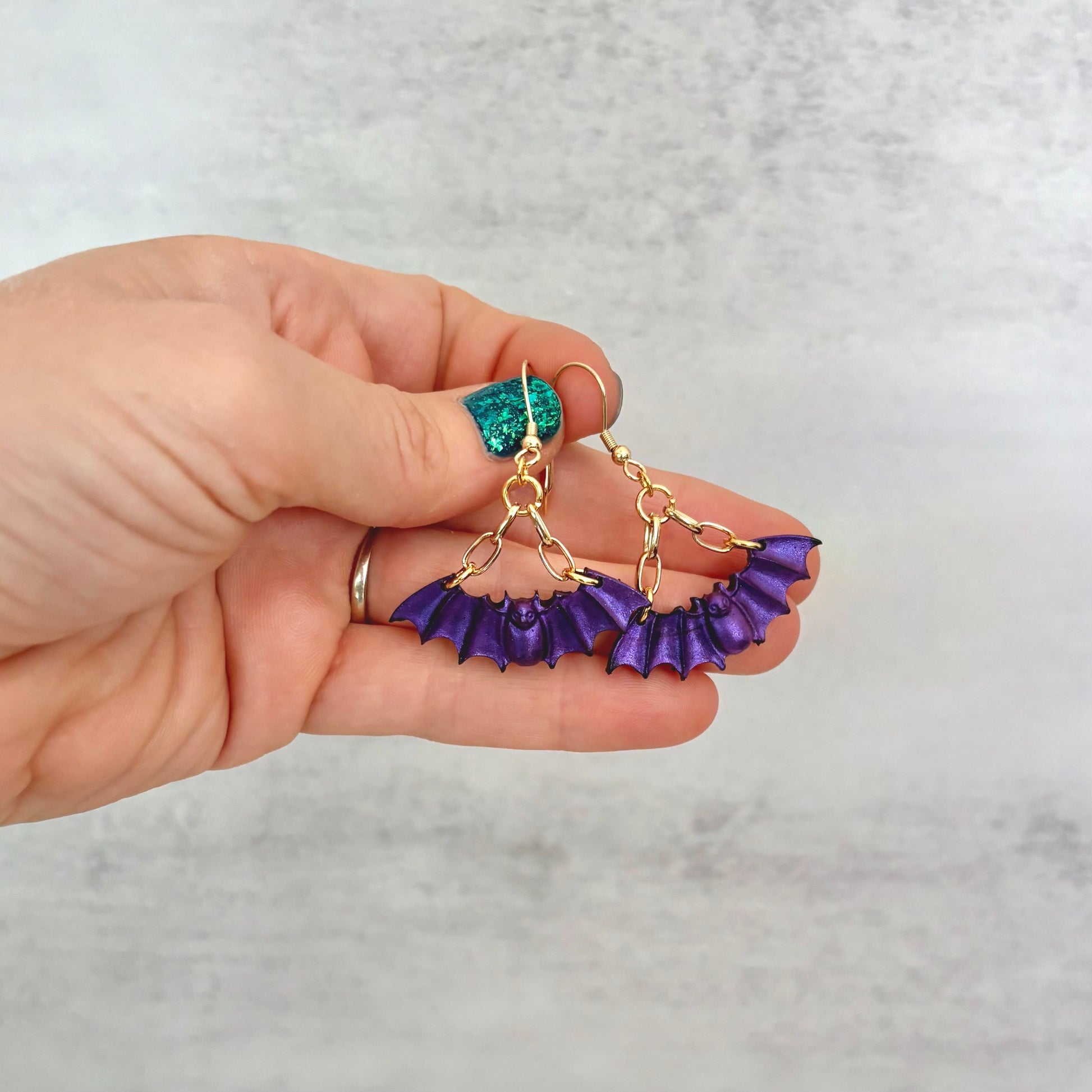 Purple Bat dangling earrings