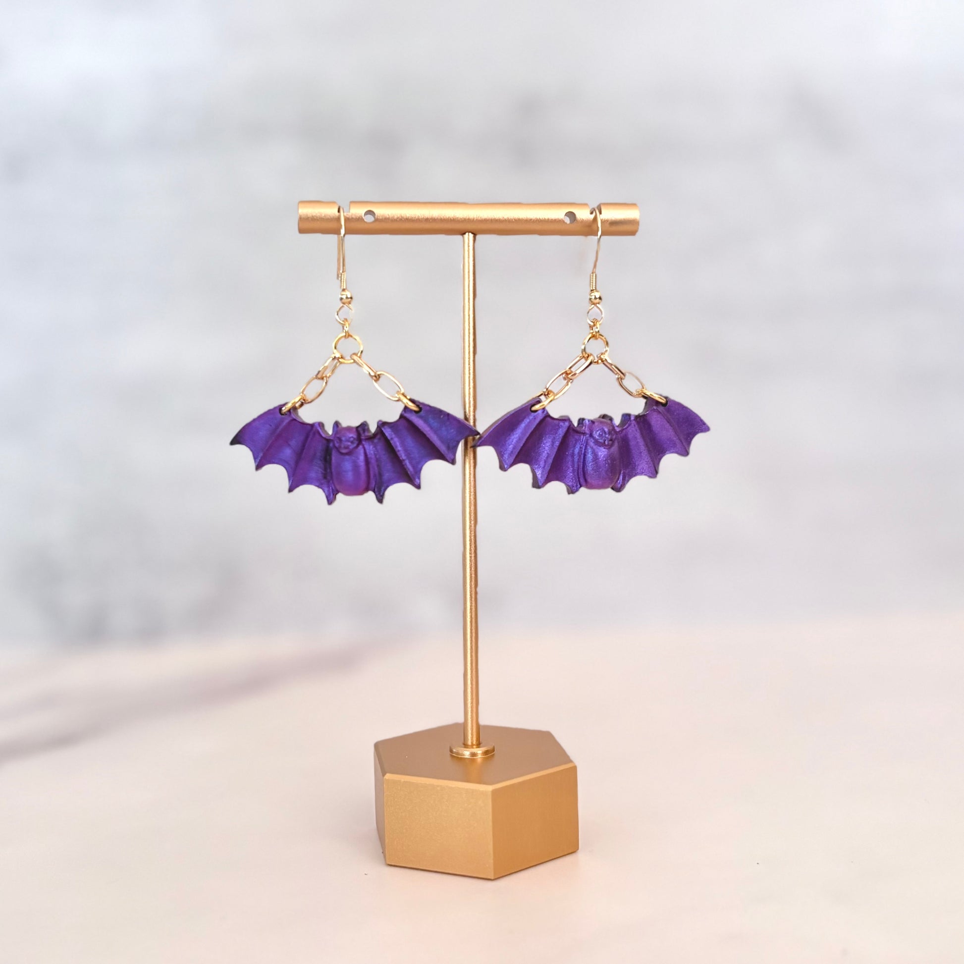 Purple Bat dangling earrings