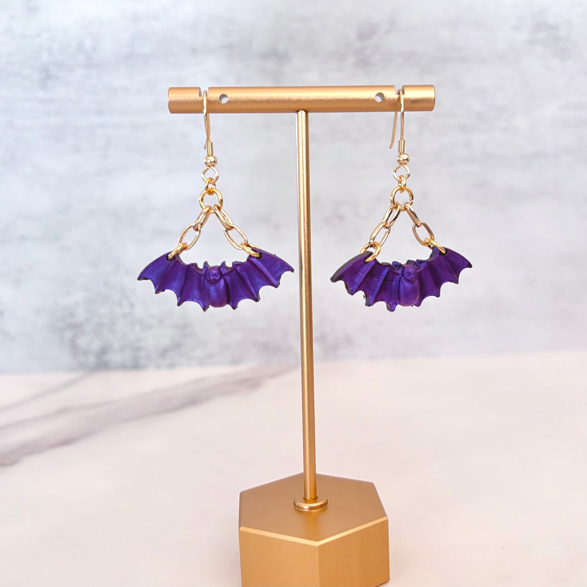 Purple Bat dangling earrings