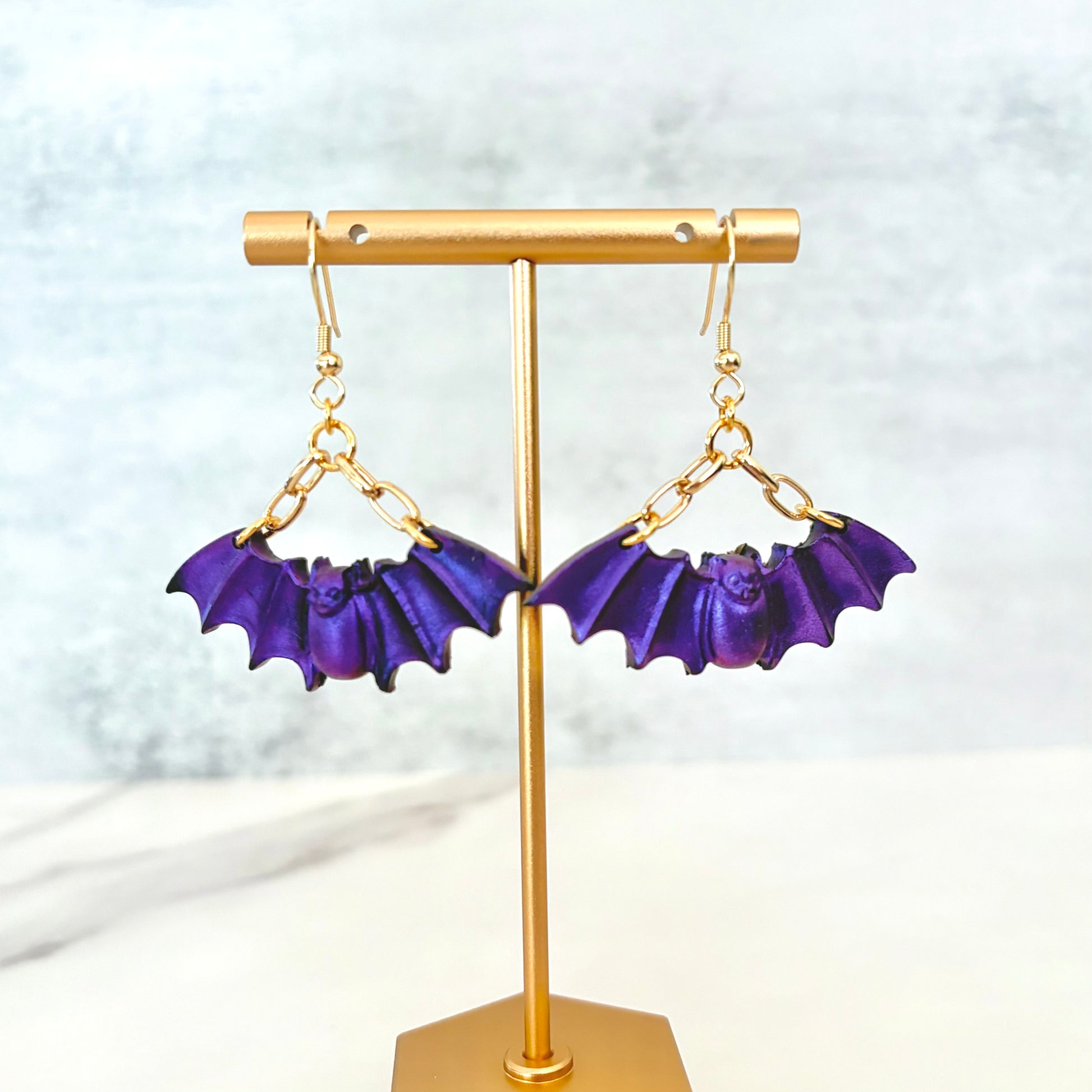 Purple Bat dangling earrings