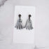 Glossy dangling ghost earrings with marble vein effect