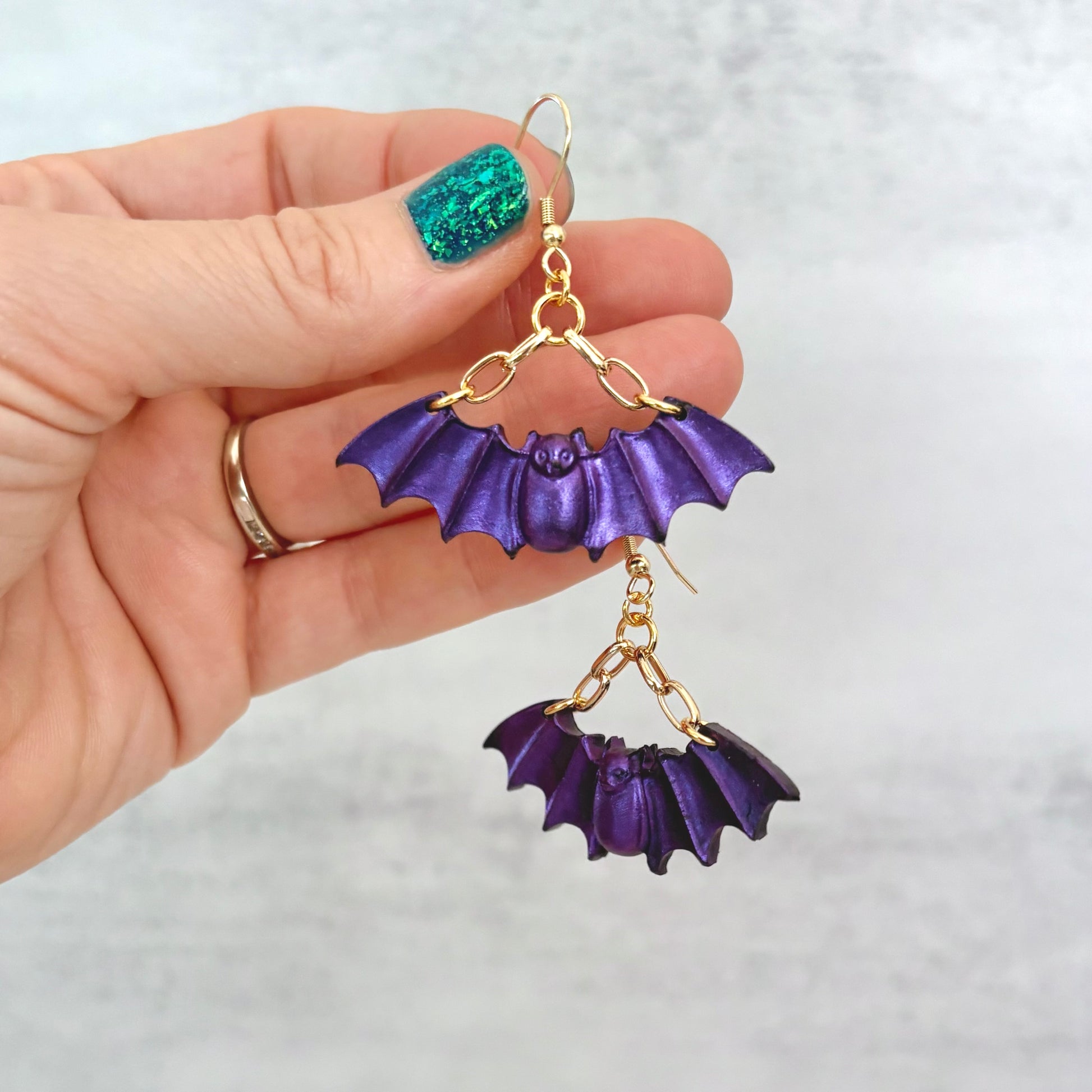 Purple Bat dangling earrings