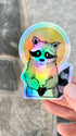 Holographic saint raccoon sticker