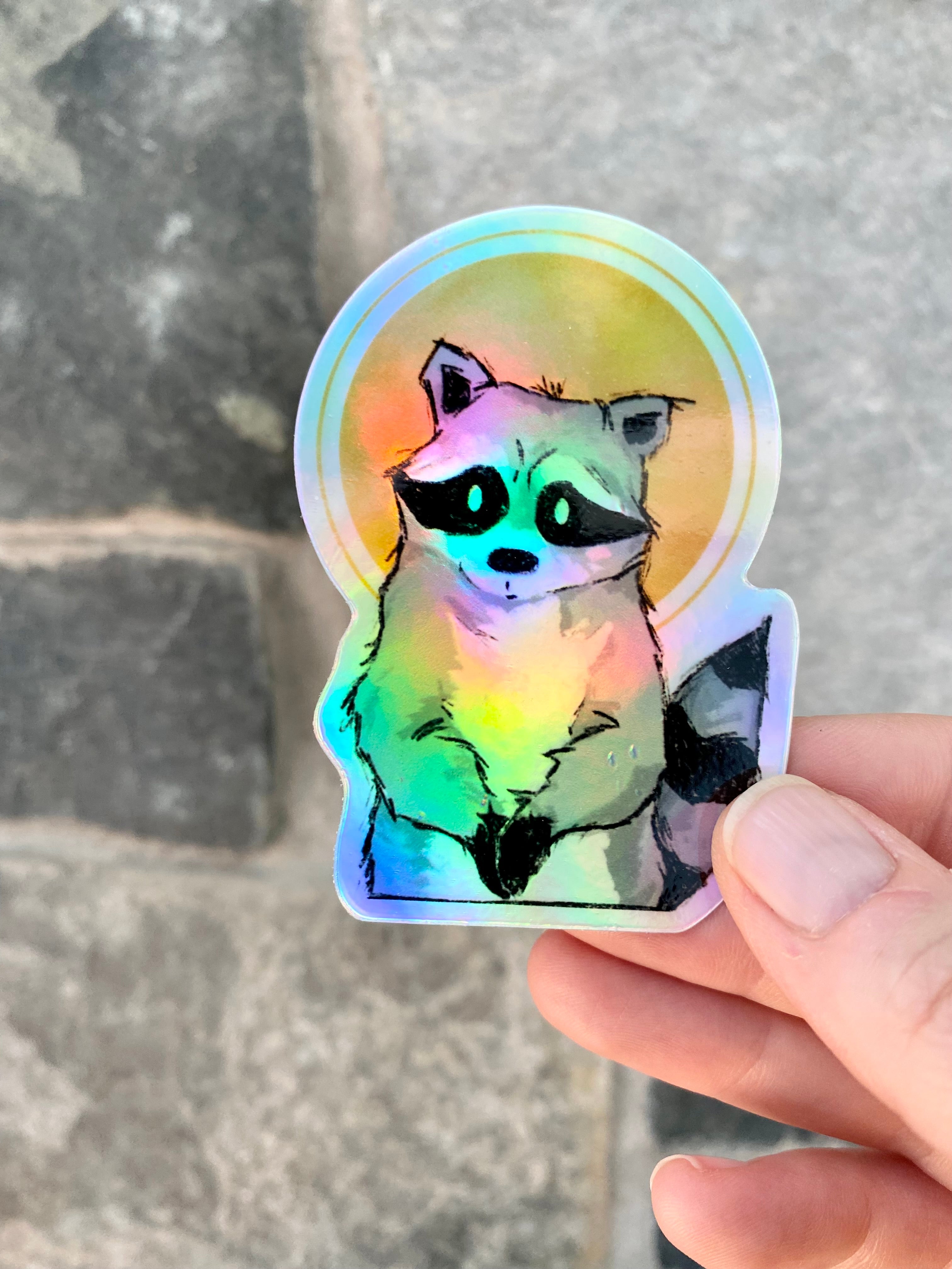 Holographic saint raccoon sticker