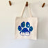 Tote bag with a blue paw print in the city design 