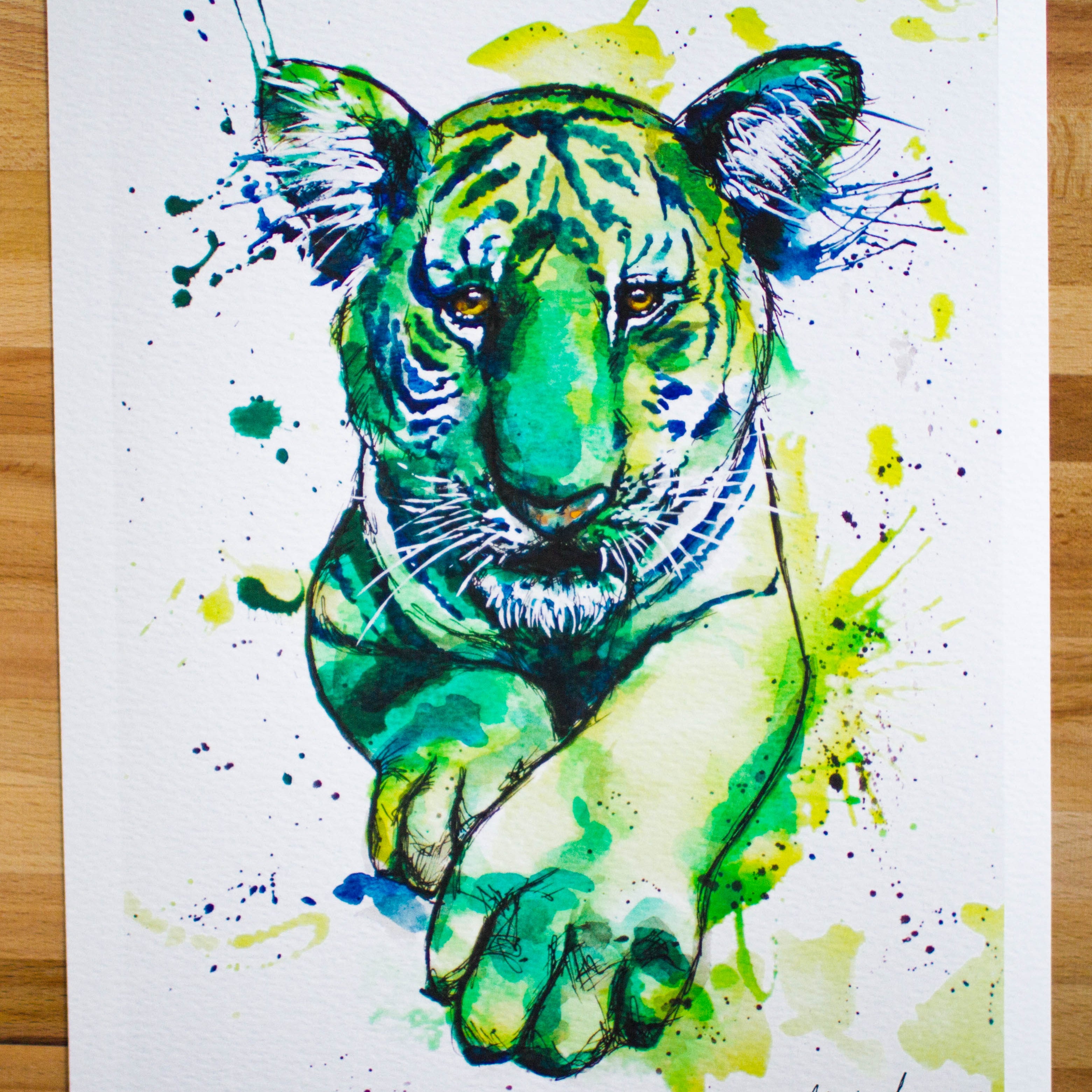 Colorful tiger painting on a wooden surface