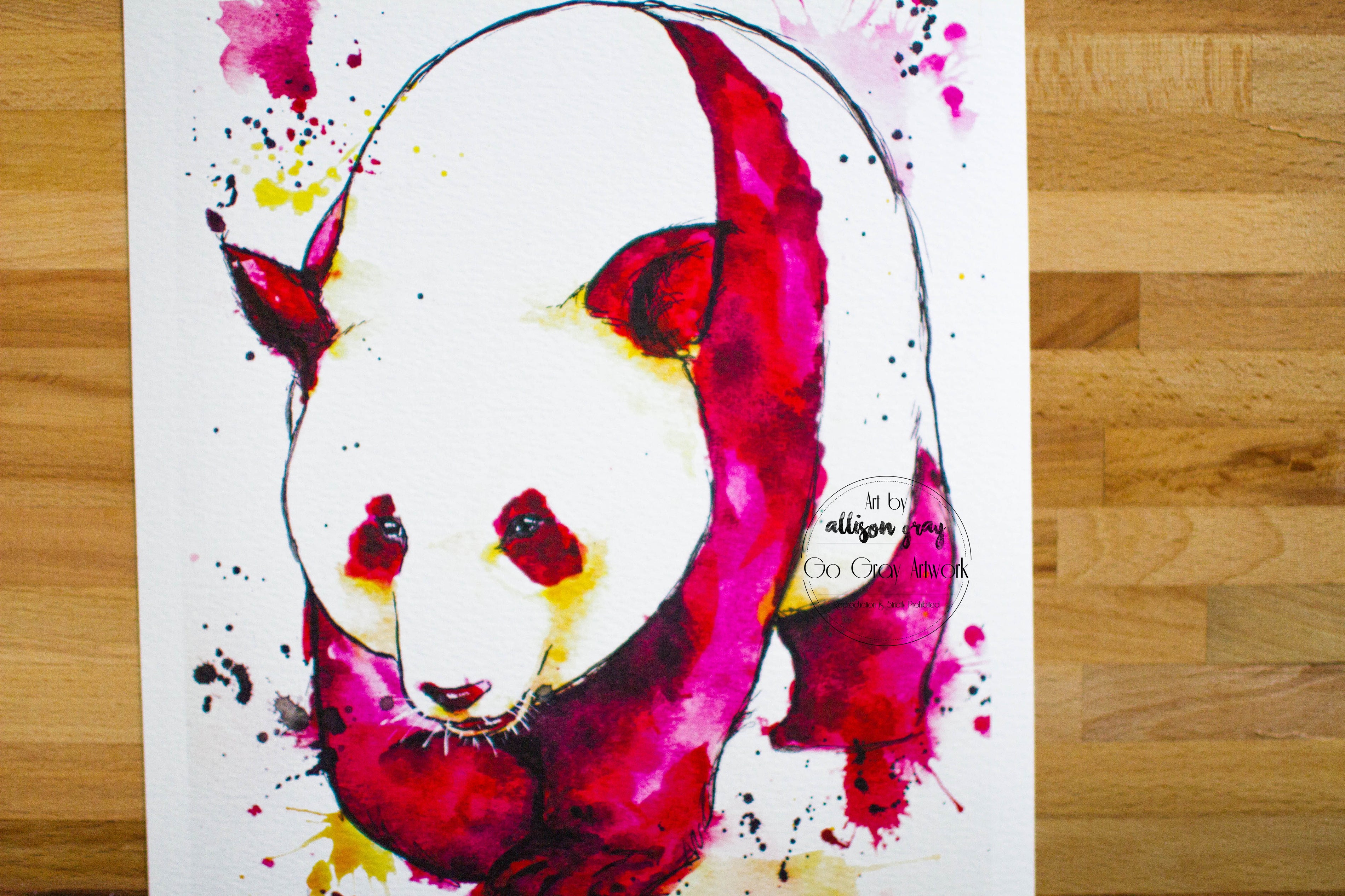 Colorful panda illustration on a white background with wooden floor.