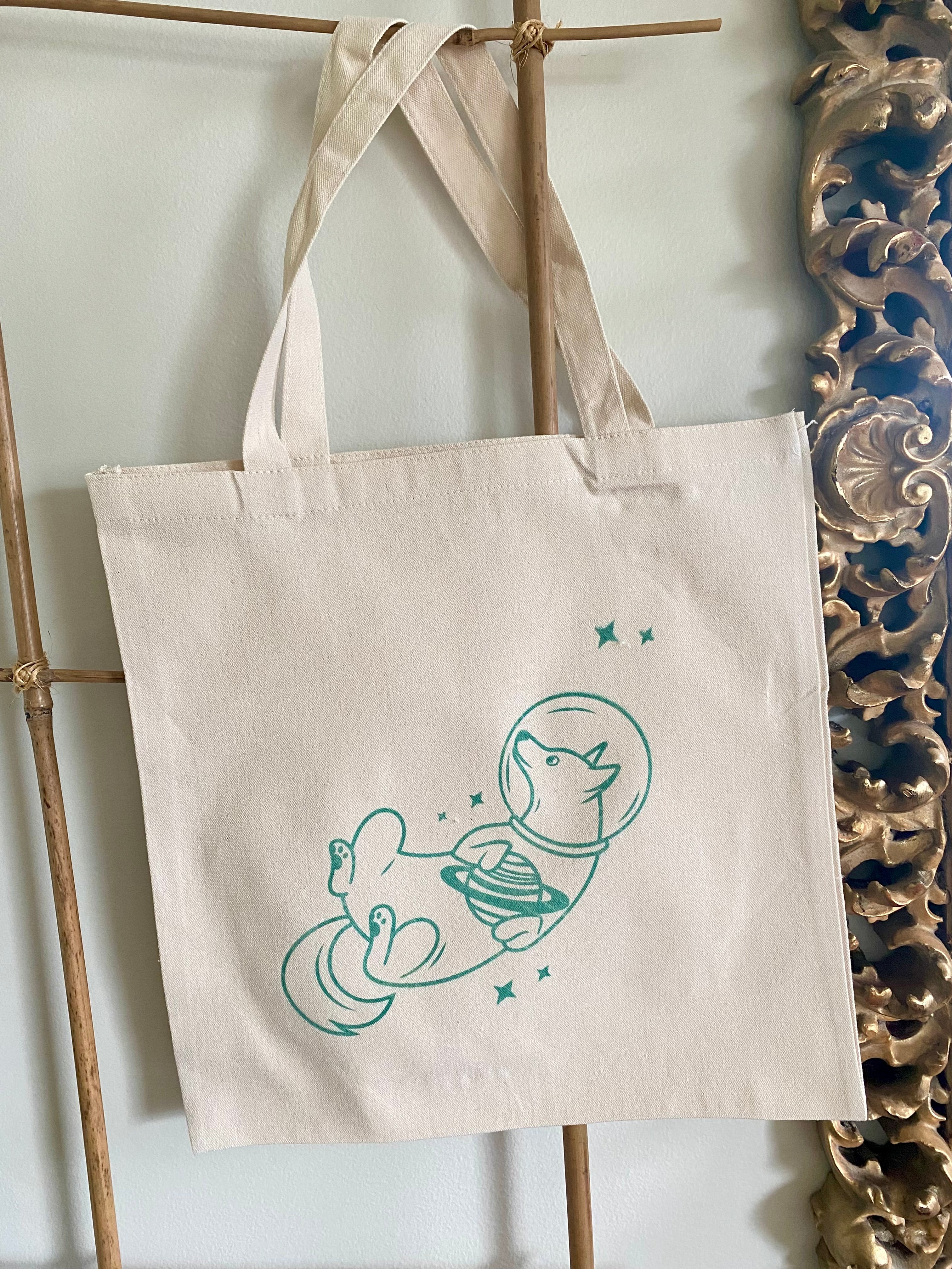 Space dog tote bag