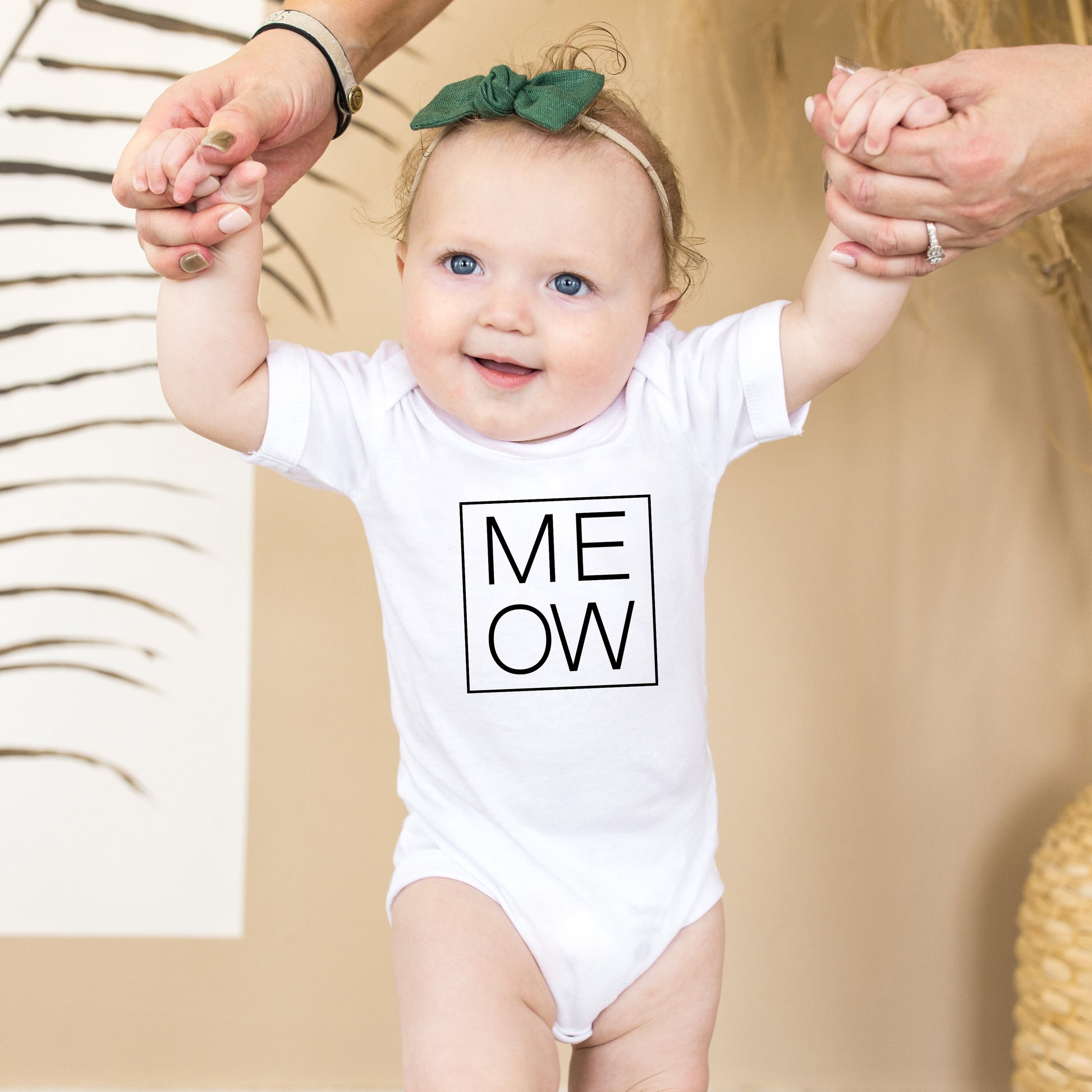 white onesie with 'MEOW' text