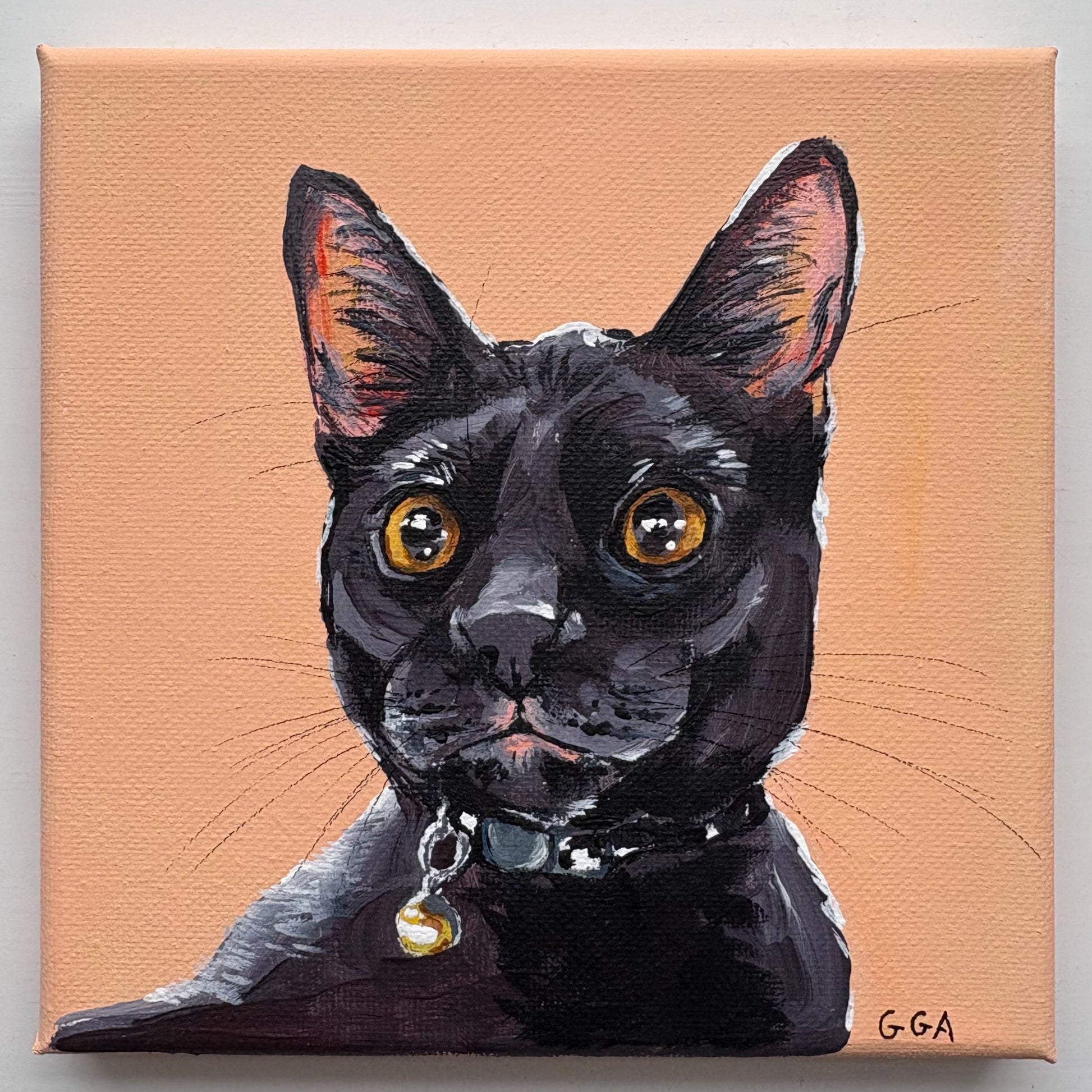 Painting of a black cat with orange eyes on a peach background