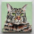 Painting of a cat with green eyes on a light green background