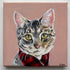 Painting of a cat wearing a red scarf on a pink background