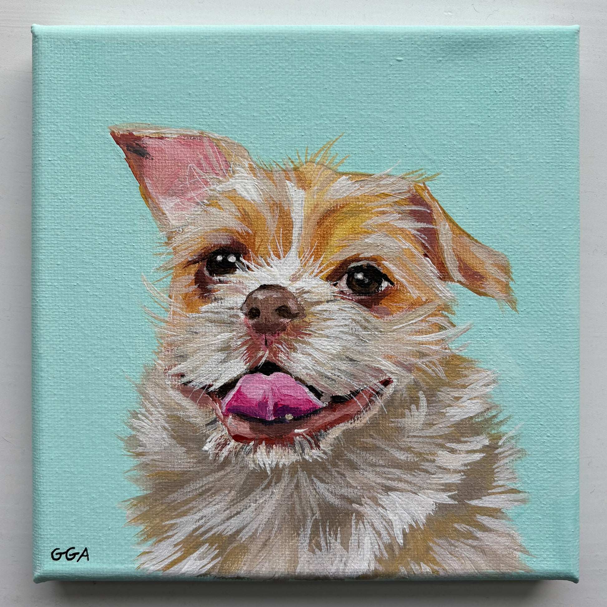 Canvas painting of a dog's face with a light blue background