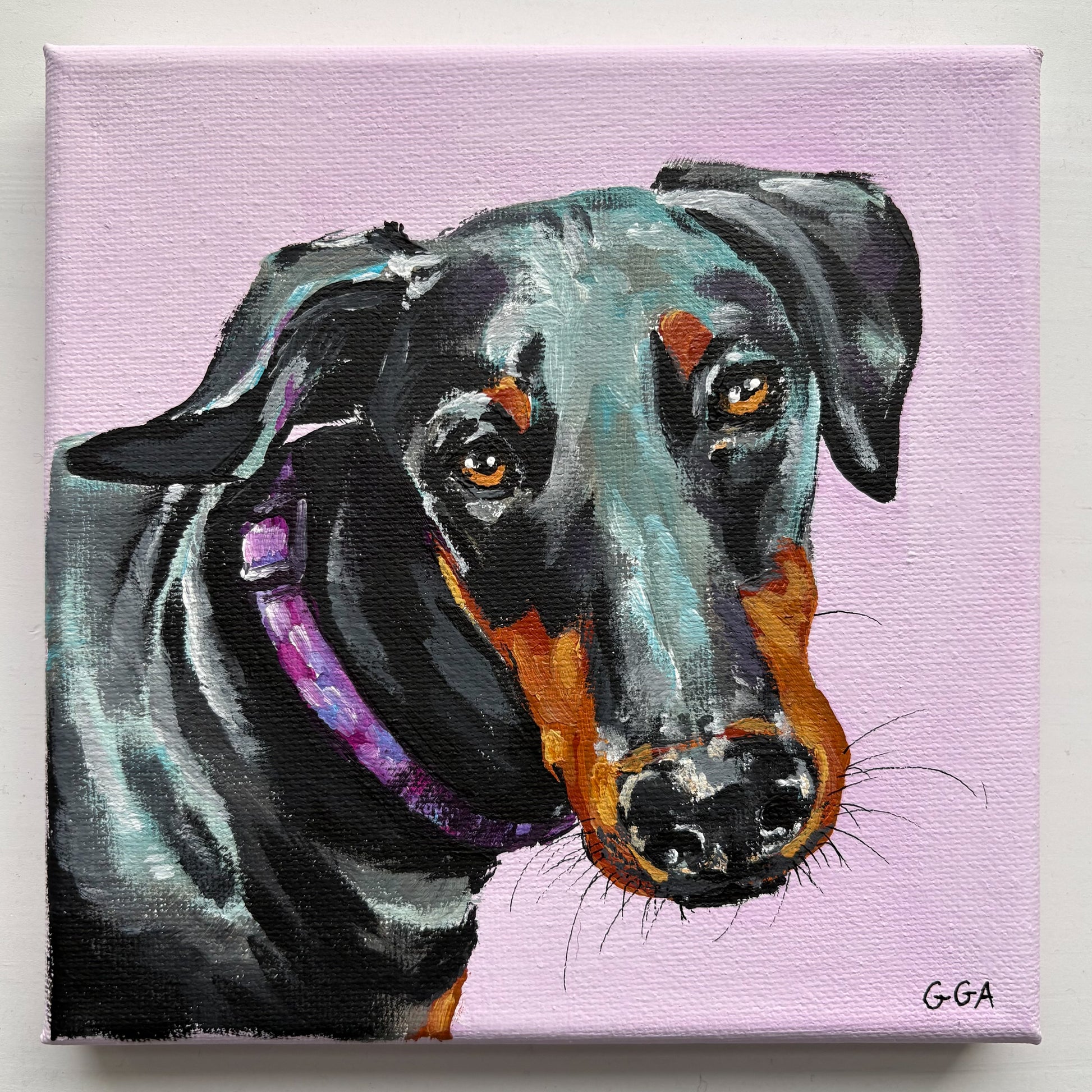 Painting of a black and brown dog on a pink background