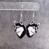Husky dog face earrings on a gray background