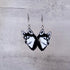 Siberian Husky dog head earrings on a gray background