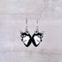 Siberian Husky dog face earrings on a gray background