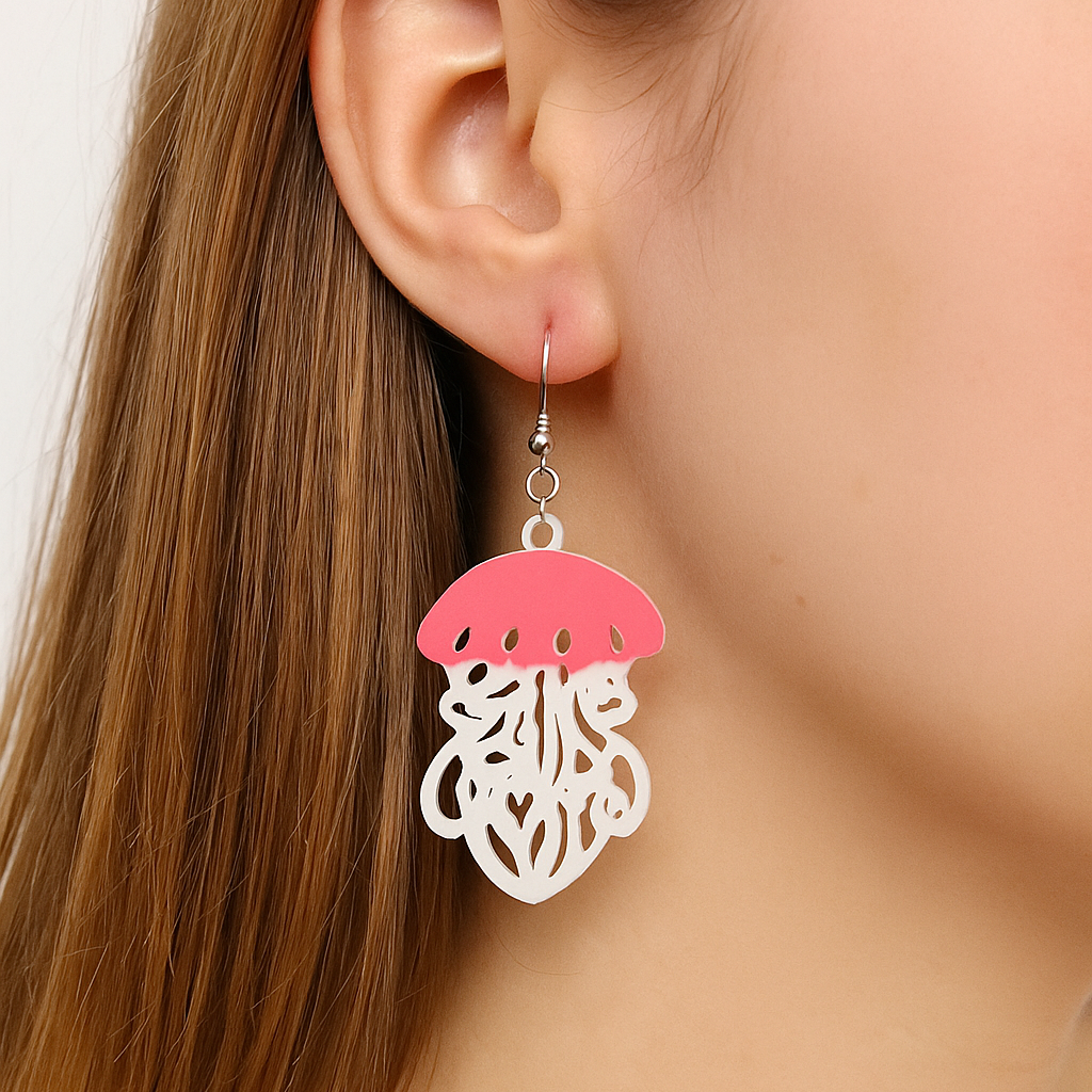 Earring with pink and white design worn by a person