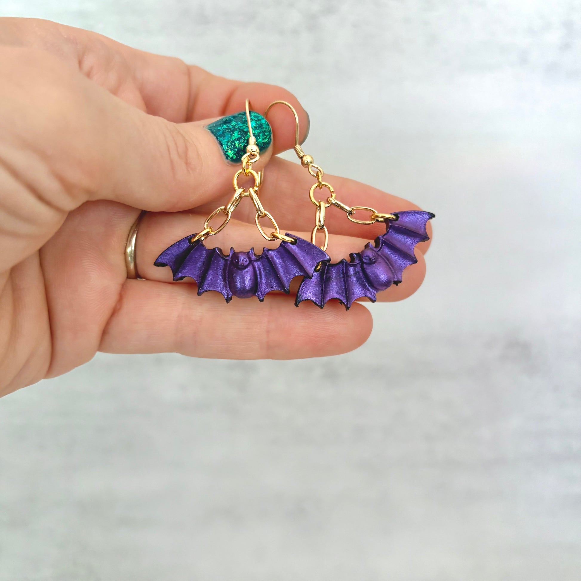 Purple Bat dangling earrings