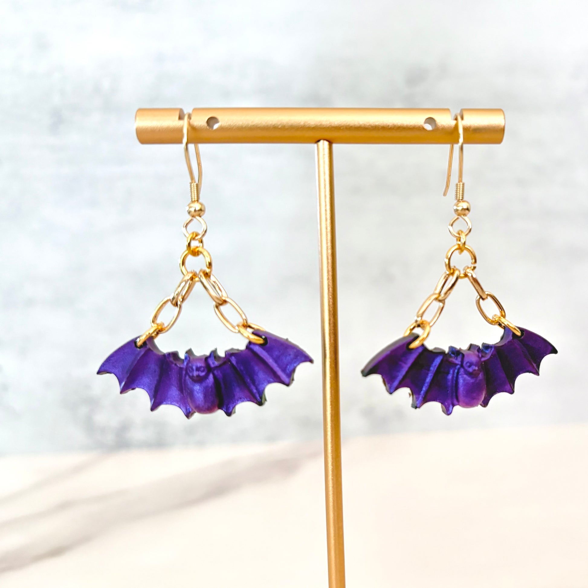 Purple Bat dangling earrings