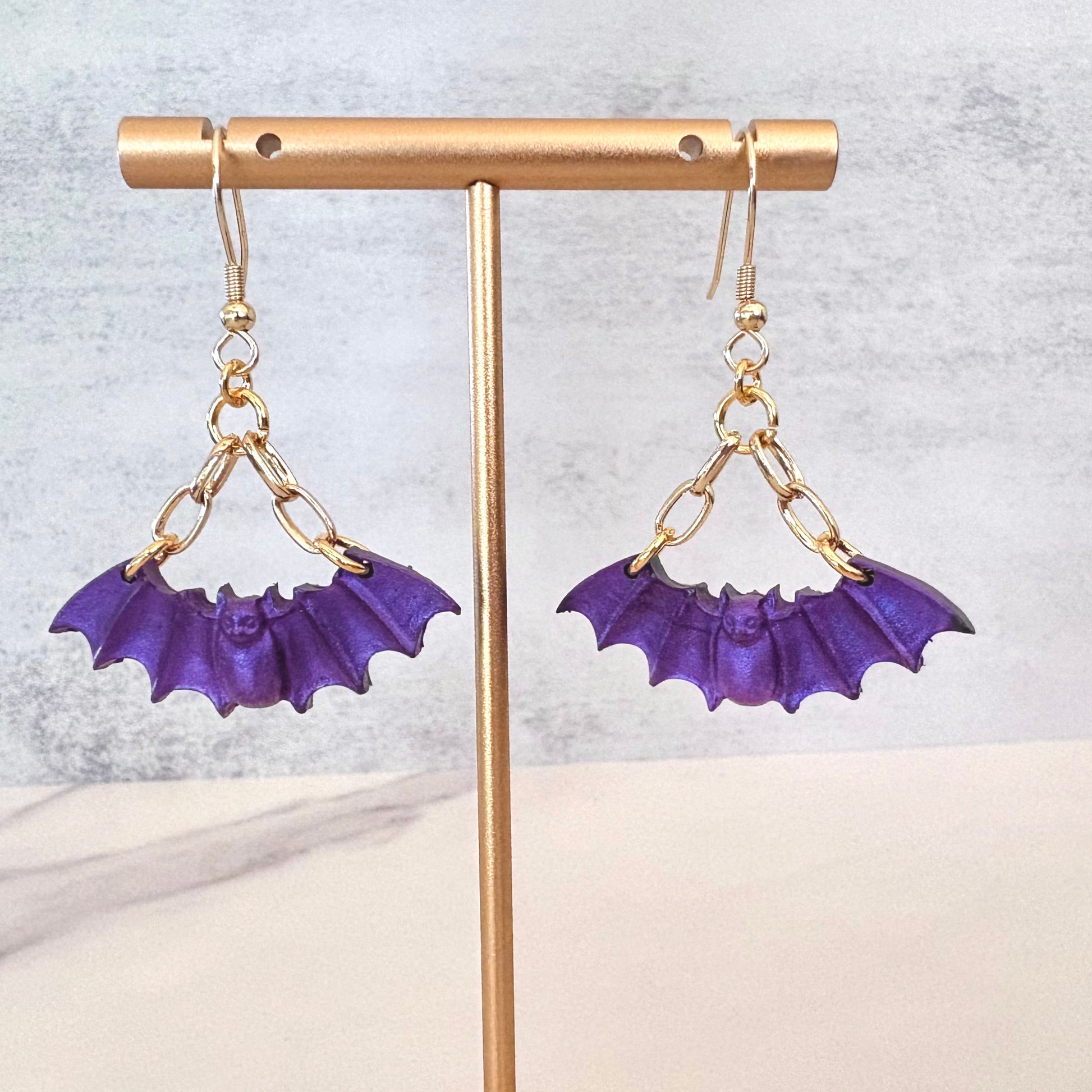Purple Bat dangling earrings