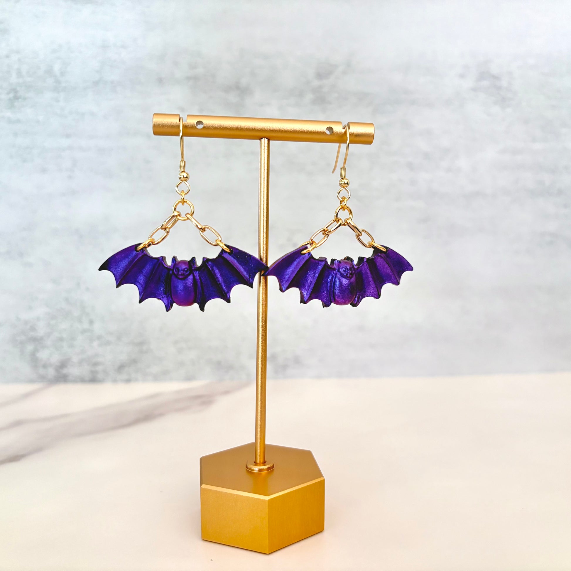 Purple Bat dangling earrings