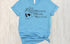 Sage green t-shirt with skull and flowers design and 'Reduce Reuse Recycle' text 