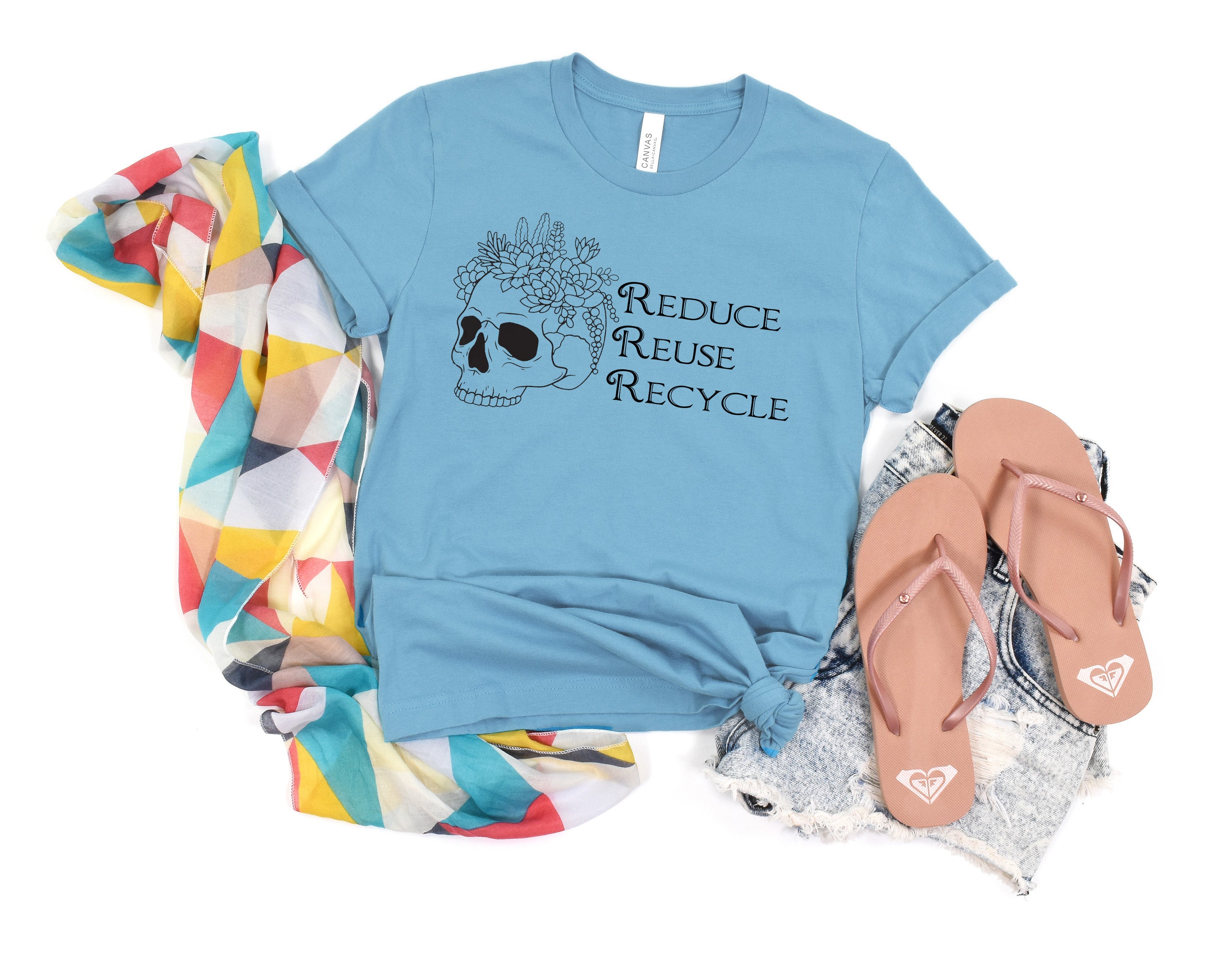 Sage green t-shirt with skull and flowers design and 'Reduce Reuse Recycle' text 