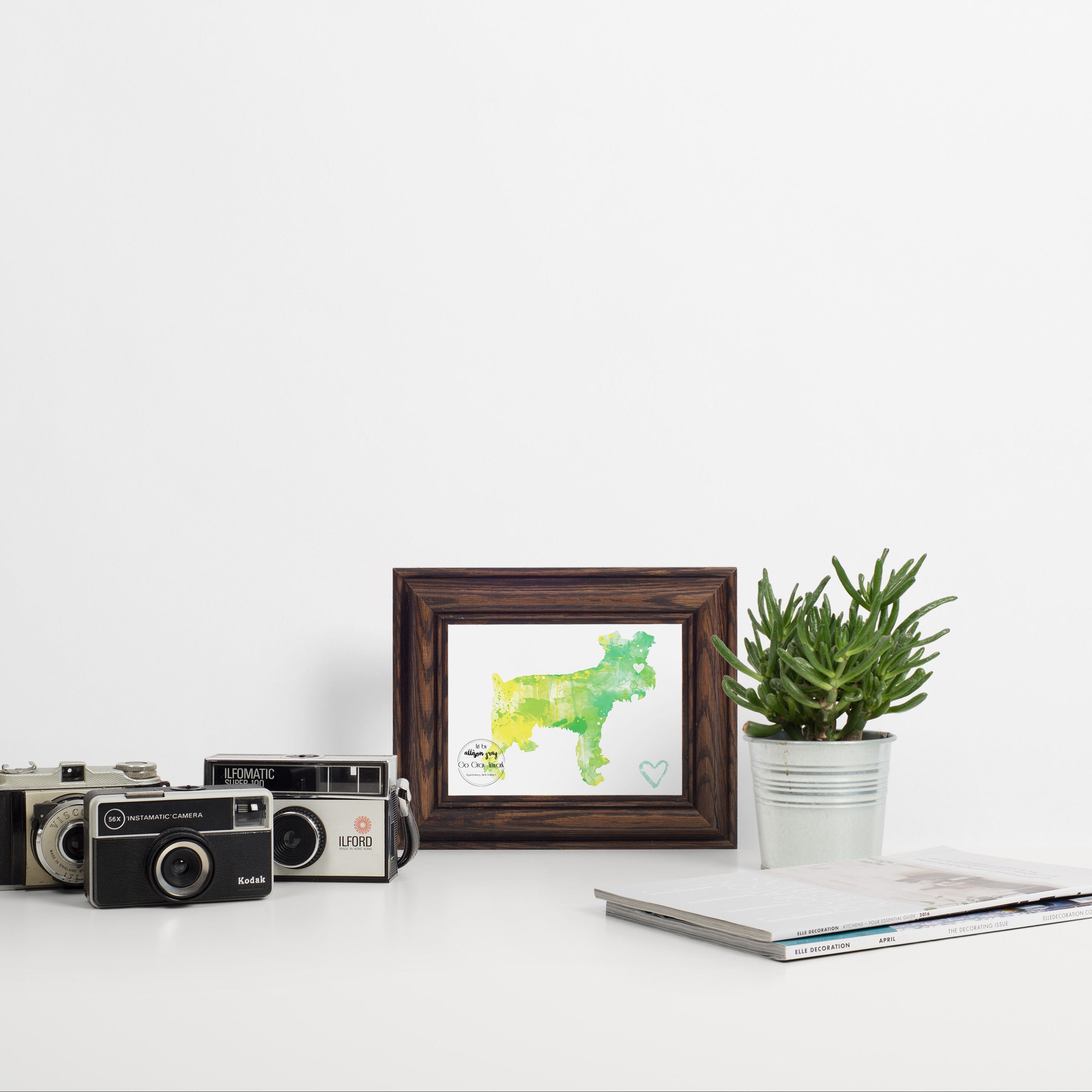Framed artwork of a green schnauzer silhouette