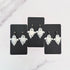 Glossy dangling ghost earrings with marble vein effect
