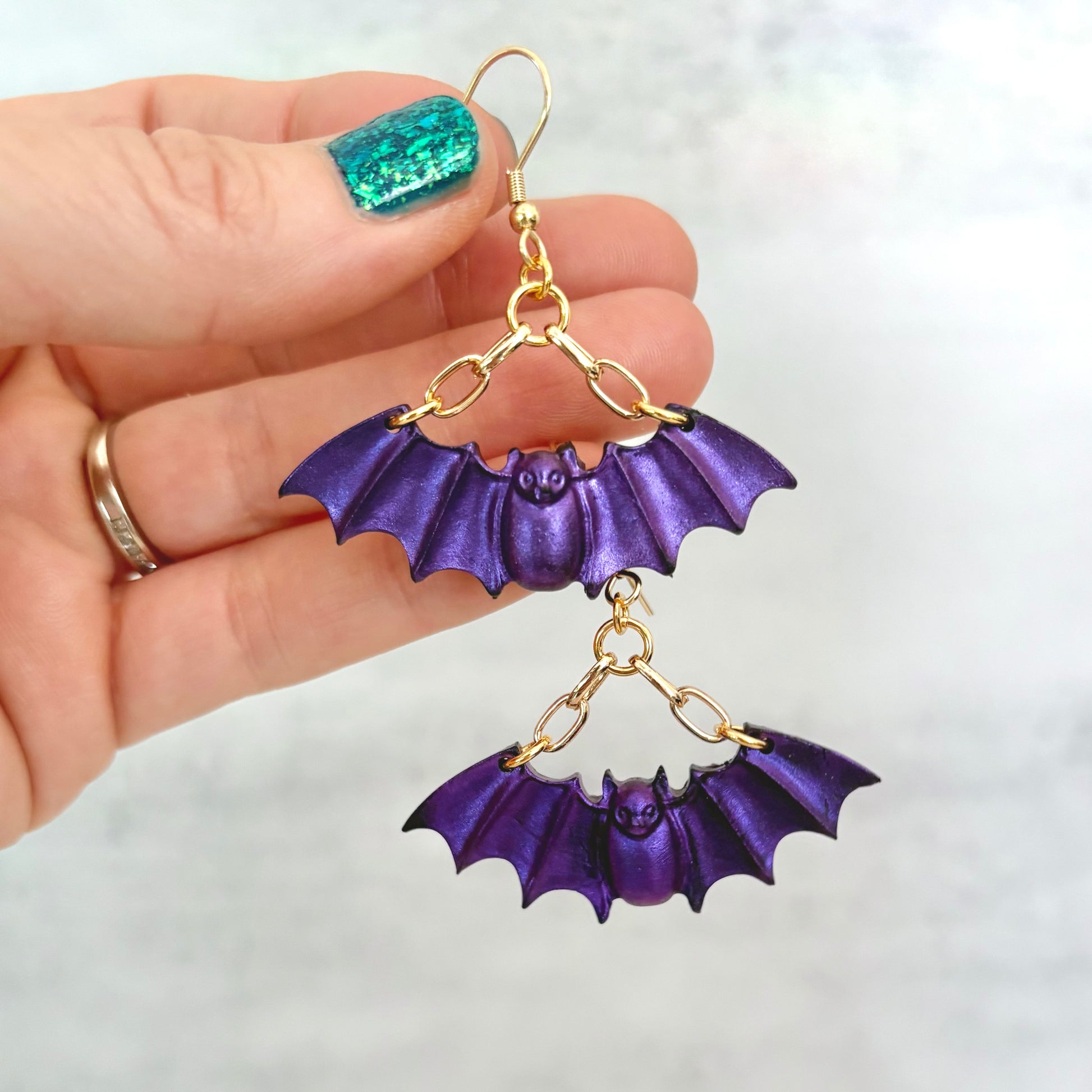 Purple Bat dangling earrings